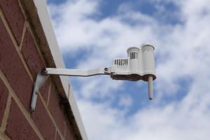 Rain sensor attached to a building