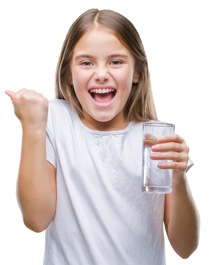 Young girl smiling while holding a glass of water