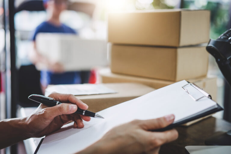 A person reviewing incoming shipment of goods